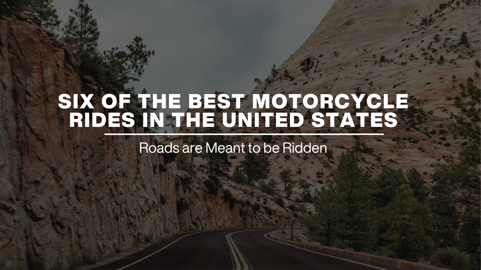 A ribbon of highway cut through green mountains looks like the Blue Ridge Parkway